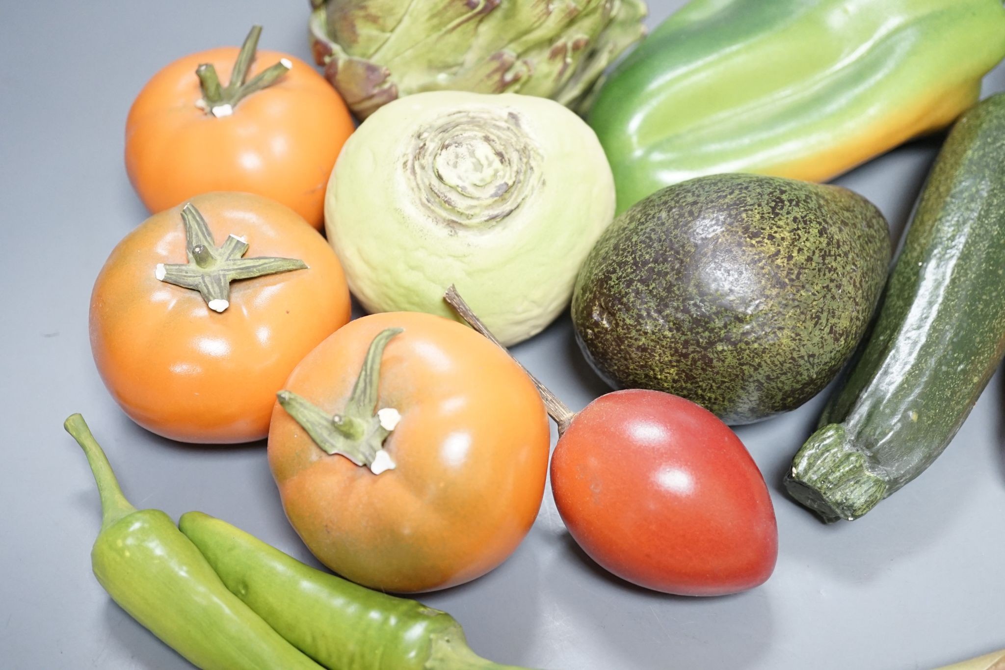 A collection of vintage Penkridge ceramic vegetables including an artichoke, avocado, peppers and asparagus (19 items)